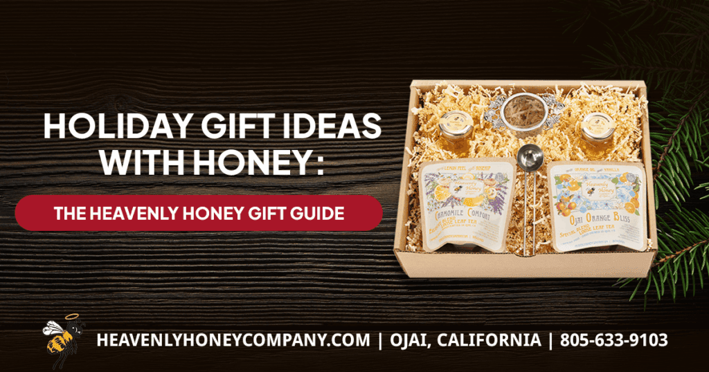 A Heavenly Honey gift pack with Chamomile Comfort and Ojai Orange Bliss teas and honey, on a dark wood background with pine branches. Text reads: Holiday Gift Ideas with Honey: The Heavenly Honey Gift Guide.